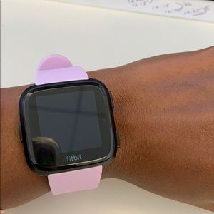 FitBit Versa Smartwatch with lilac heyday band